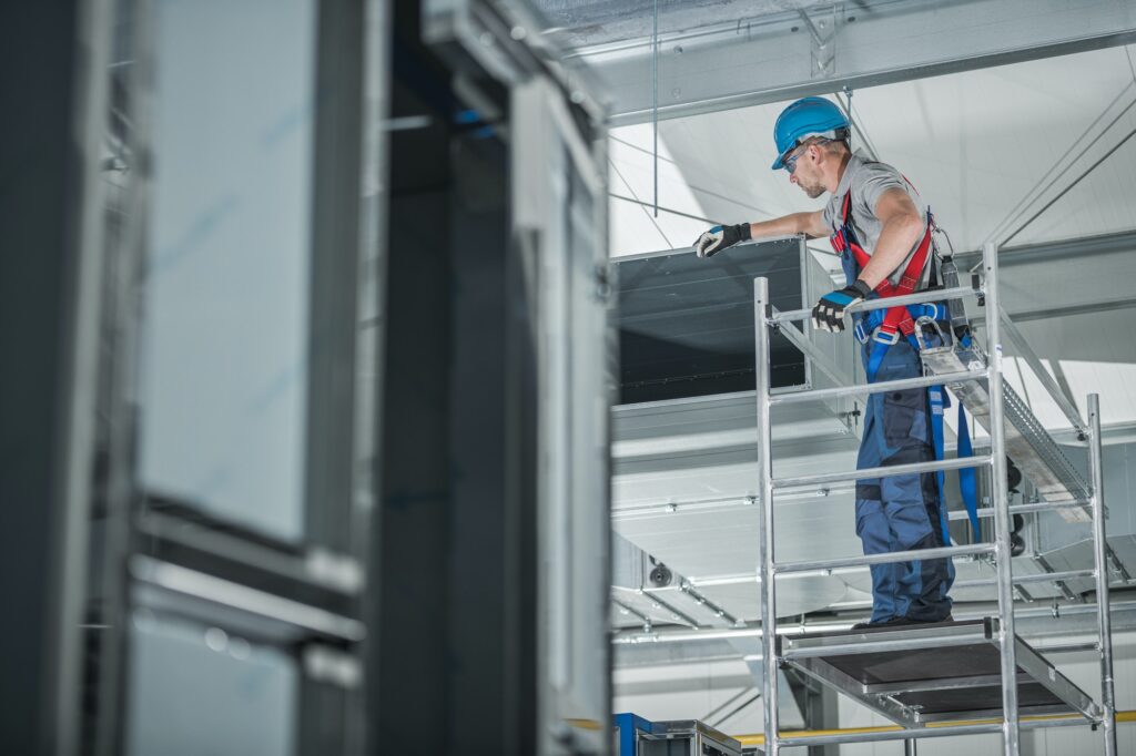 Air Ventilation Technician Checking Installed Shaft.